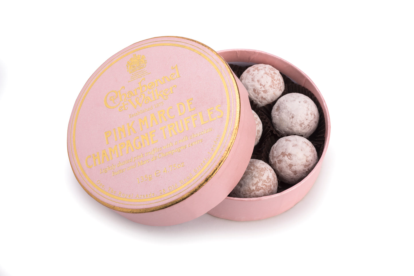 A pink and gold round box of truffles