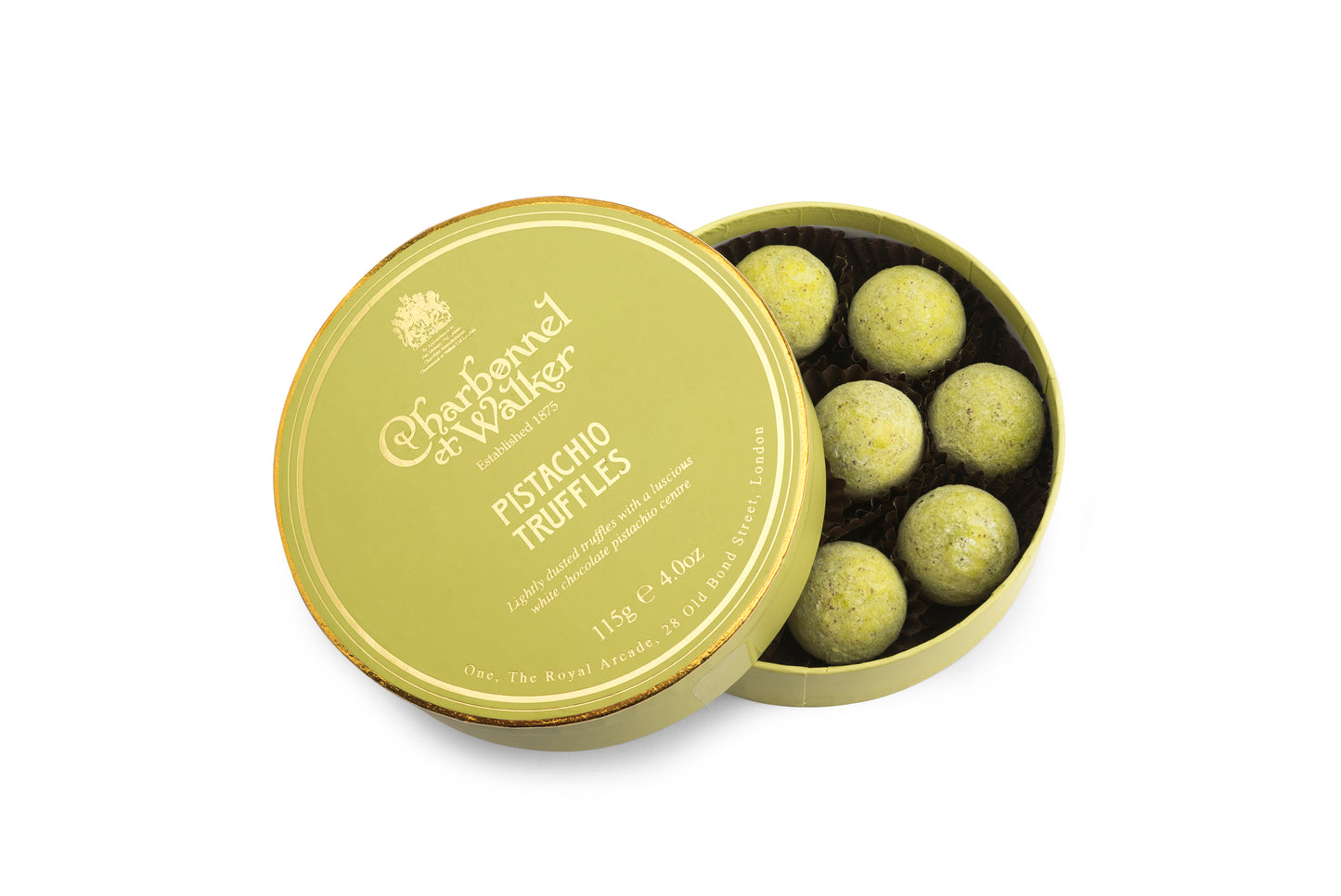 A pale green and gold circular box of pistachio truffles