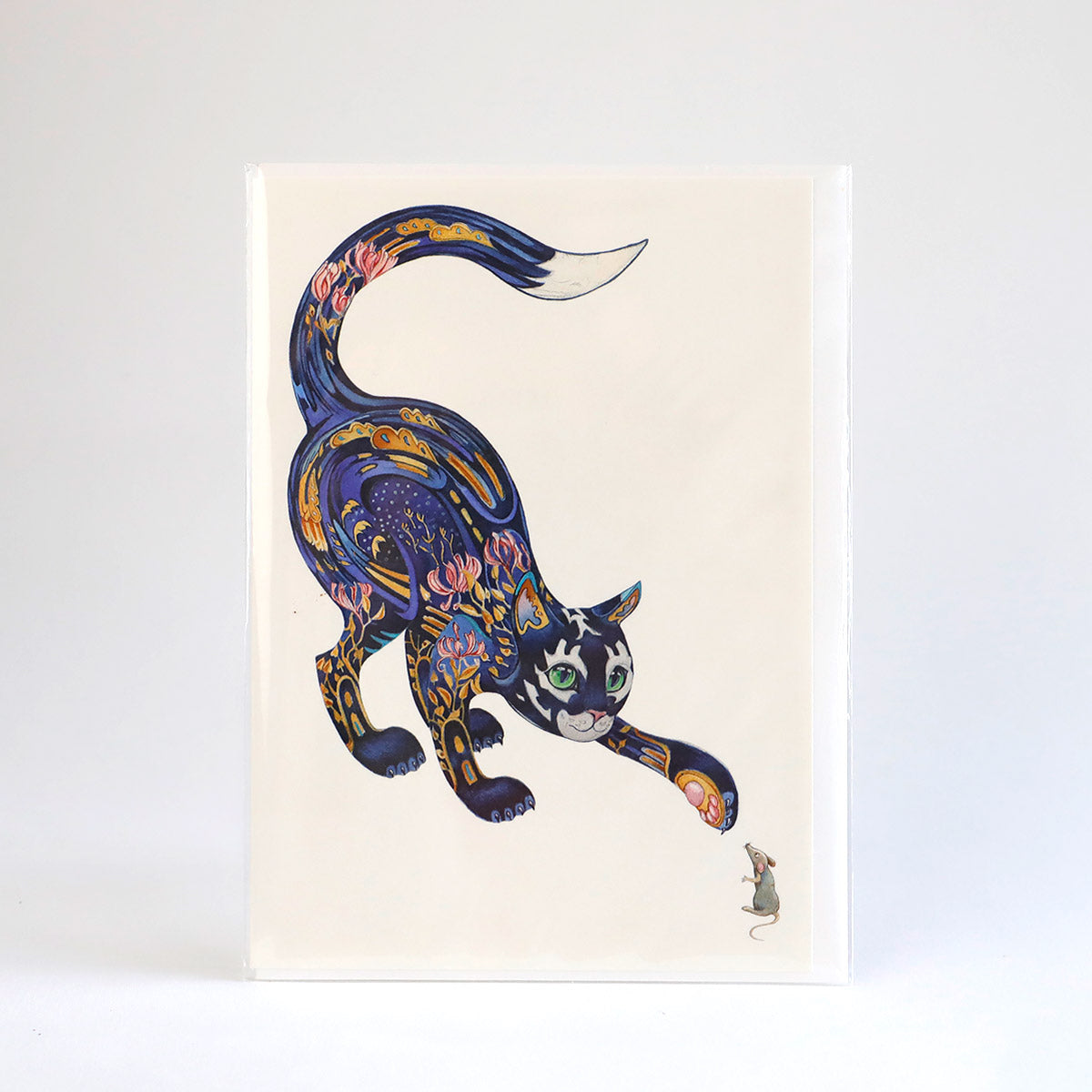 A greetings card illustrated with a playful cat and mouse