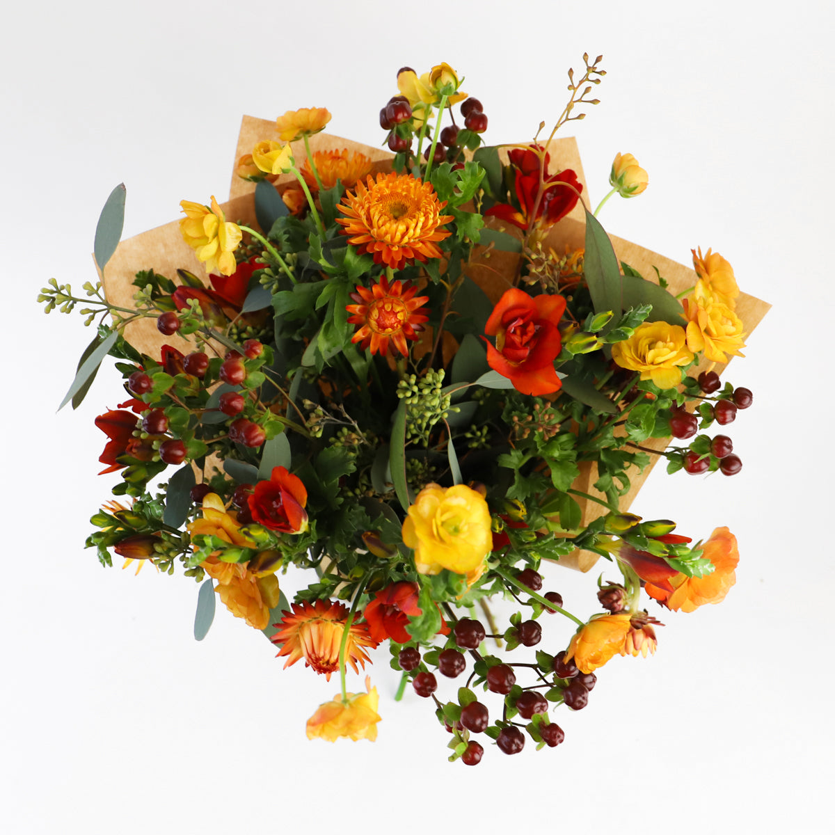 Over head view of the orange, yellow and red autumn bouquet