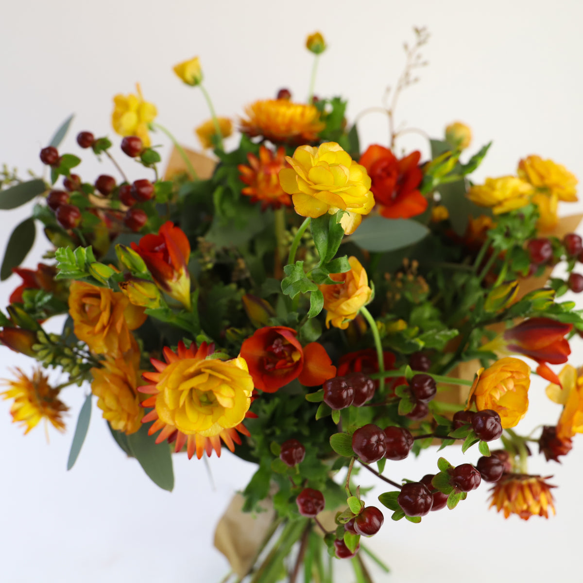 Close up of the orange, yellow and red autumn bouquet