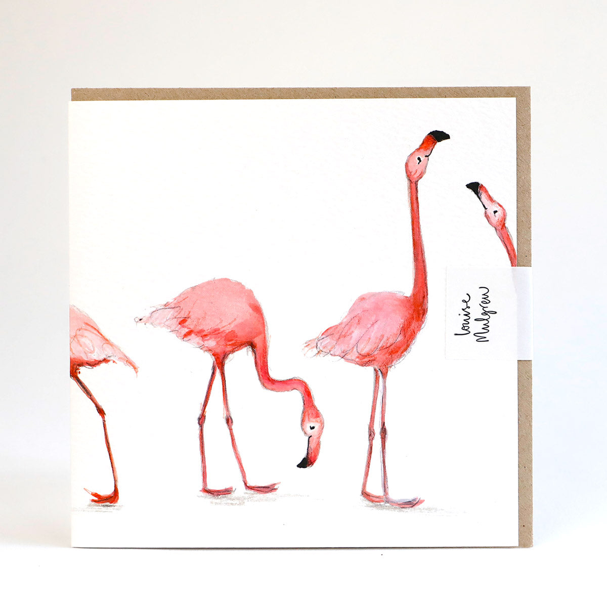 A greetings card with a painterly illustration of flamingoes