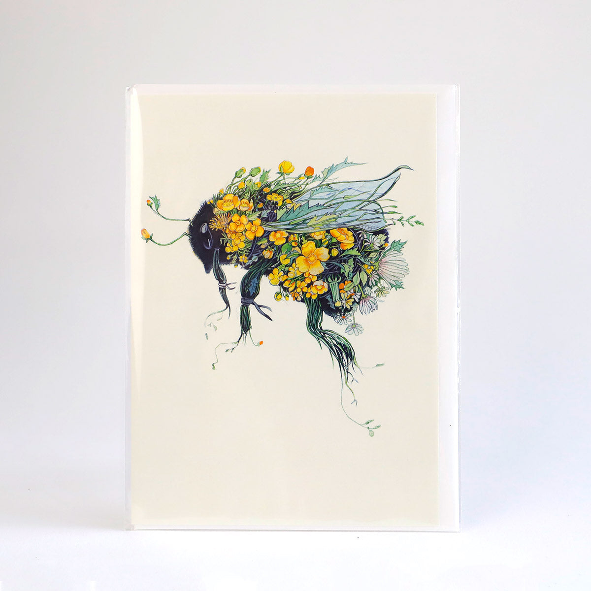 A greetings card with an illustration of a bee and flowers