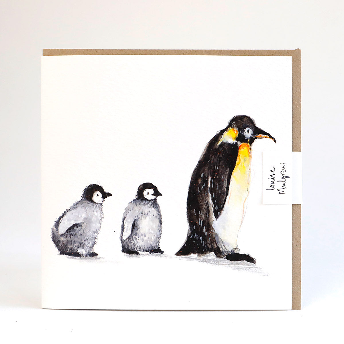 A greetings card illustrated with a penguin and two fluffy chicks